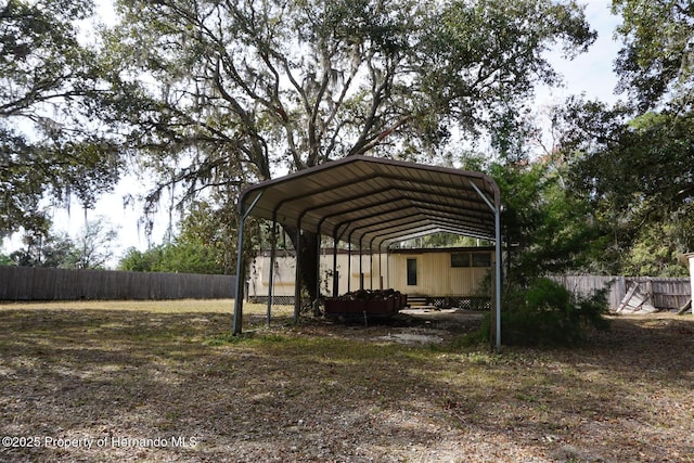 view of vehicle parking featuring a carport