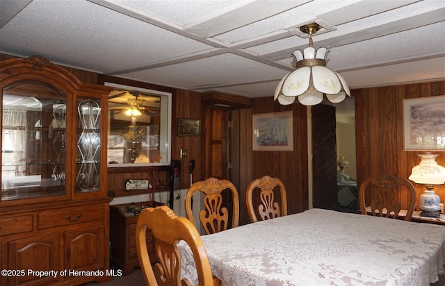 dining area with wood walls