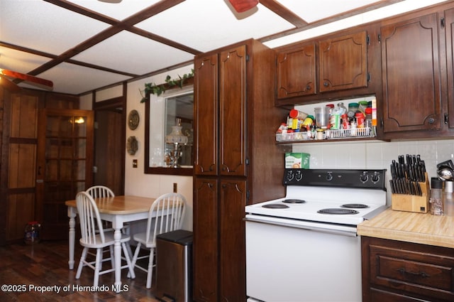 kitchen with dark wood-type flooring, electric range, and backsplash