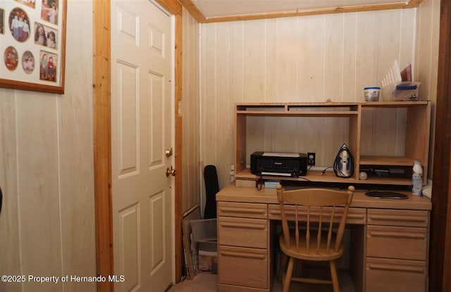 office area with wood walls