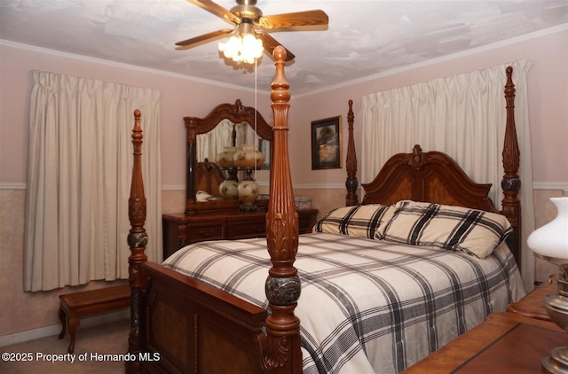 bedroom with ornamental molding and ceiling fan