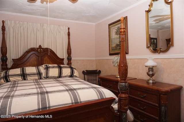 bedroom with crown molding and ceiling fan