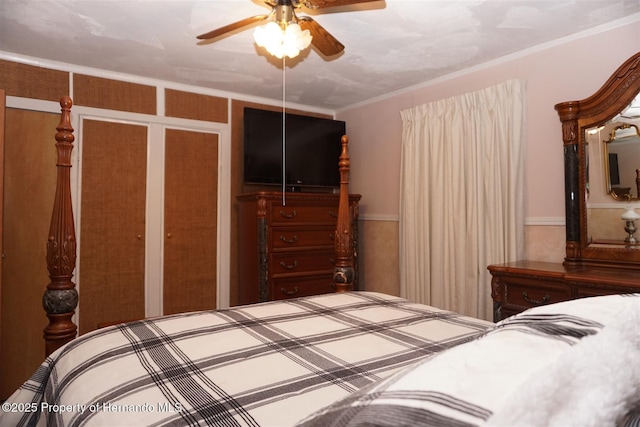 bedroom with ornamental molding and ceiling fan