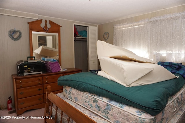 carpeted bedroom with a closet