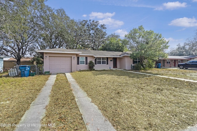 view of front of house featuring a garage and a front yard