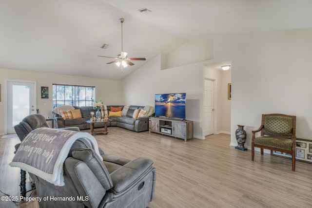 living room featuring high vaulted ceiling, light hardwood / wood-style floors, and ceiling fan