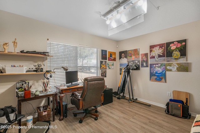 office space with wood-type flooring