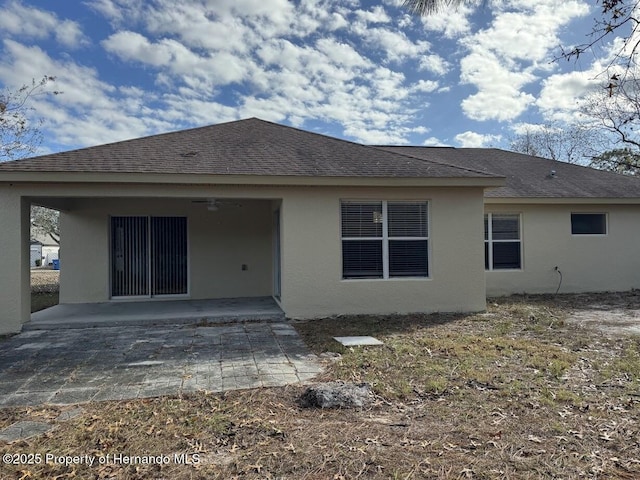 back of house with a patio area and ceiling fan