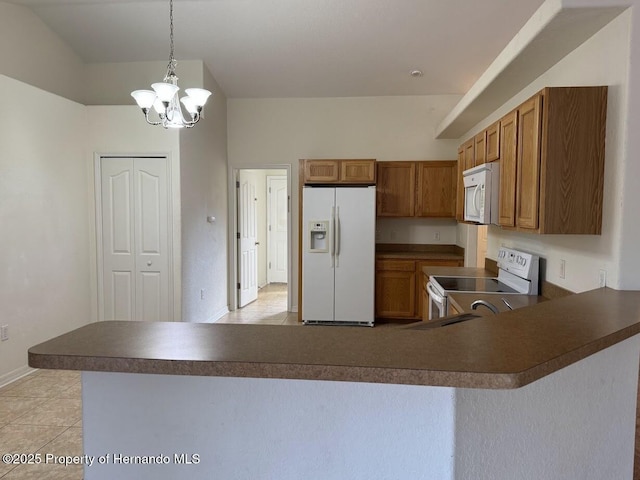 kitchen with light tile patterned floors, white appliances, decorative light fixtures, kitchen peninsula, and a chandelier