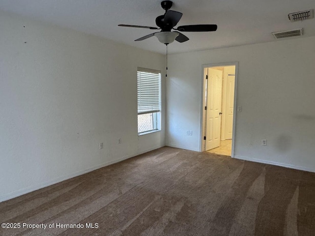 unfurnished room featuring light colored carpet and ceiling fan