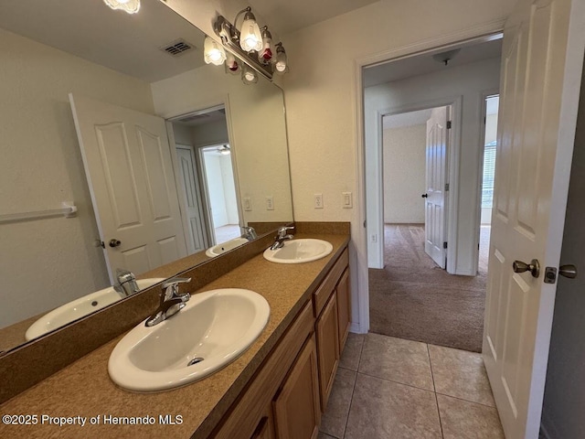 bathroom with vanity and tile patterned flooring