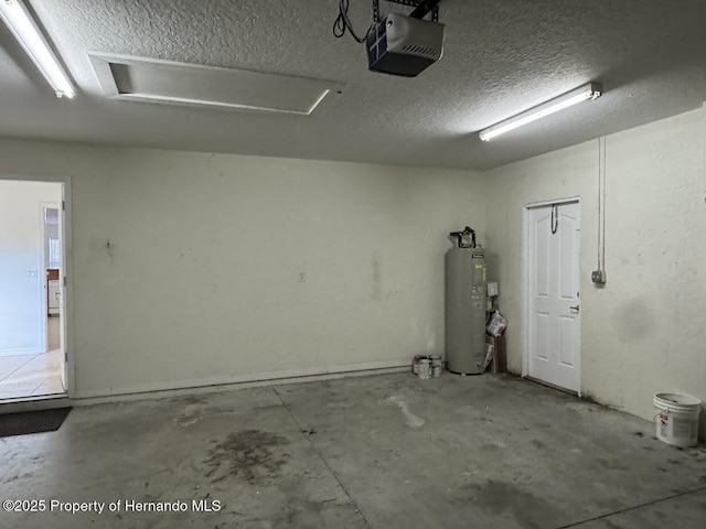 garage with a garage door opener and water heater