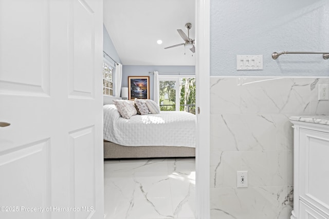 bedroom with marble finish floor and a ceiling fan