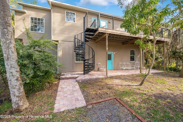 rear view of house with a patio area