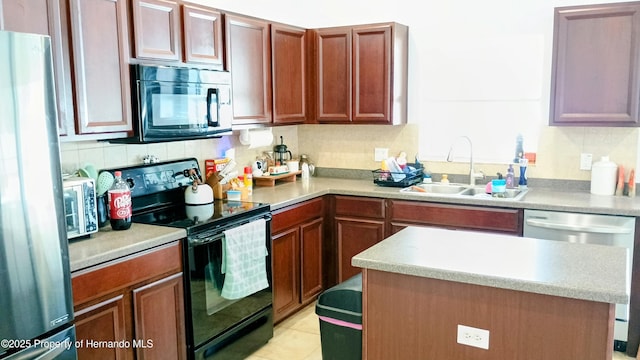 kitchen featuring tasteful backsplash, sink, light tile patterned floors, and black appliances