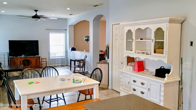 dining area featuring light tile patterned floors and ceiling fan