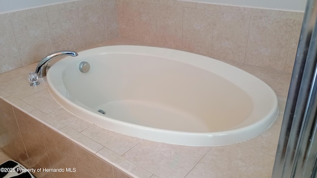 bathroom featuring a relaxing tiled tub