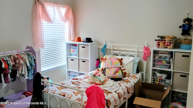 bedroom featuring multiple windows