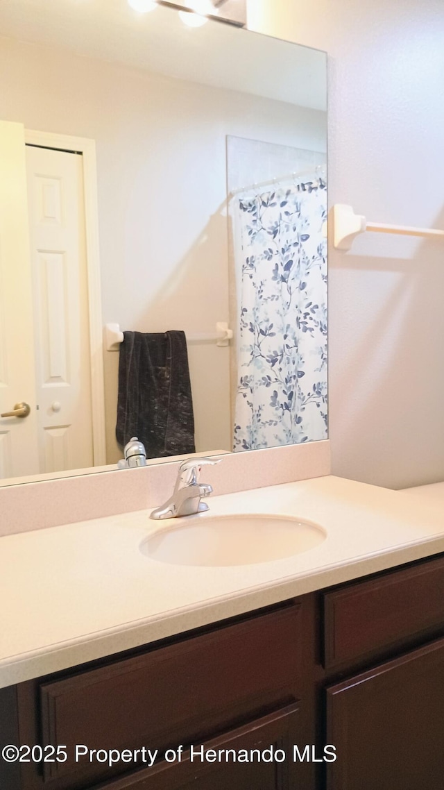 bathroom with vanity and a shower with curtain