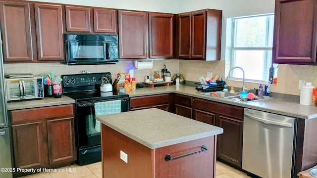 kitchen with backsplash, a center island, sink, and black appliances