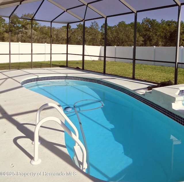 view of pool featuring a lanai and a patio