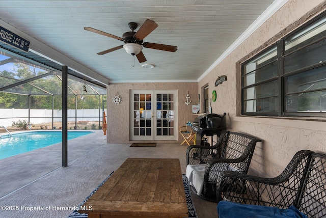 view of swimming pool featuring a patio, a lanai, french doors, and ceiling fan