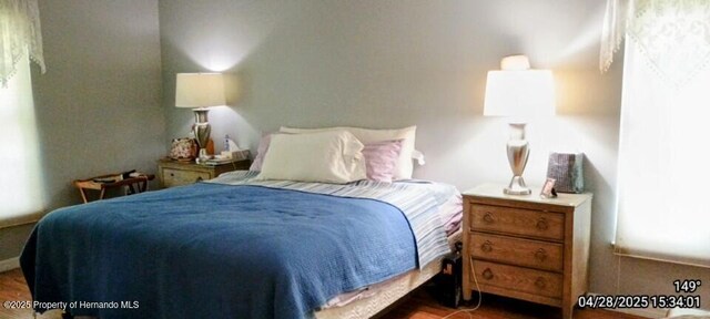 bedroom with wood finished floors