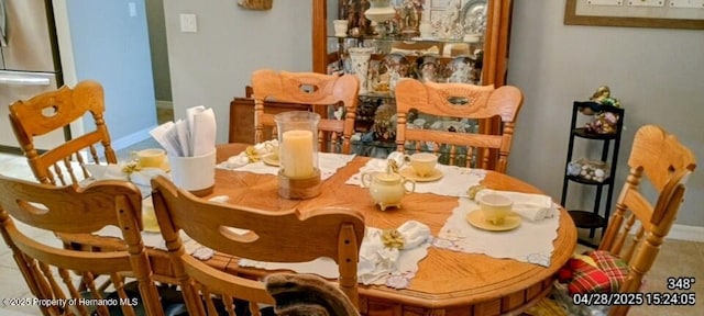 dining area featuring baseboards