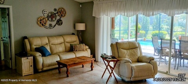 living area featuring light tile patterned floors