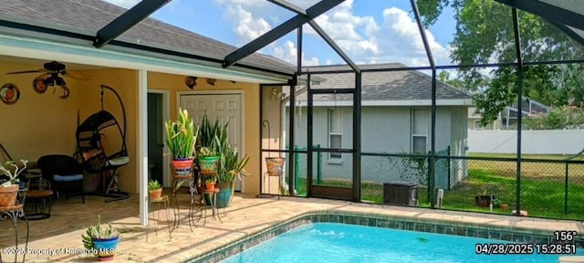 view of pool featuring a patio, a fenced in pool, ceiling fan, a lanai, and fence