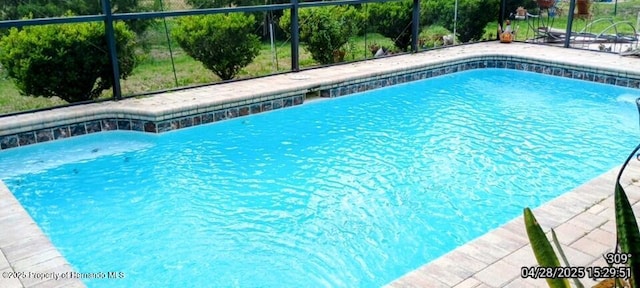 outdoor pool with glass enclosure