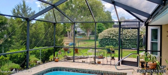 outdoor pool featuring a patio area and a lanai
