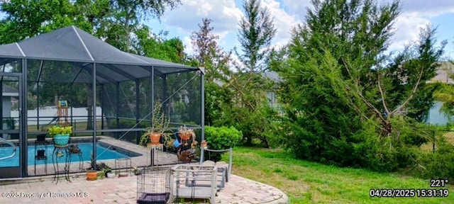 view of pool featuring a patio, a lanai, a fenced in pool, and a lawn