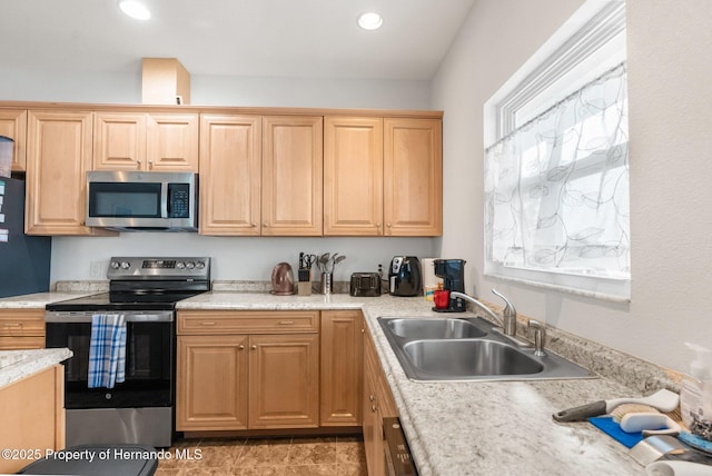 kitchen with sink and appliances with stainless steel finishes