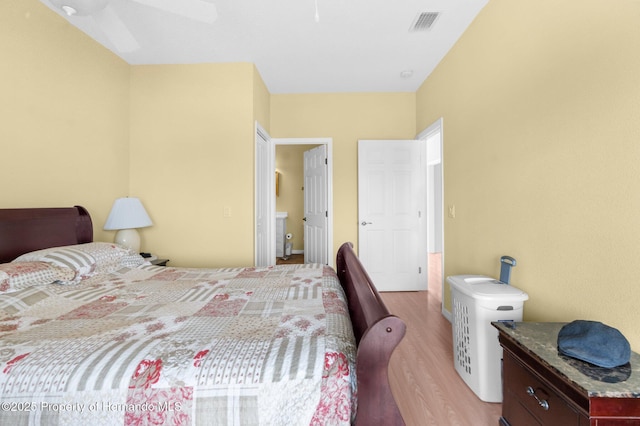 bedroom with light hardwood / wood-style flooring and ceiling fan