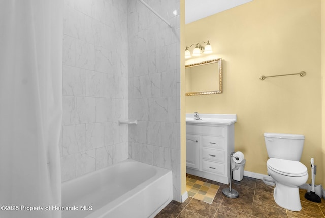 full bathroom with vanity, tiled shower / bath combo, and toilet