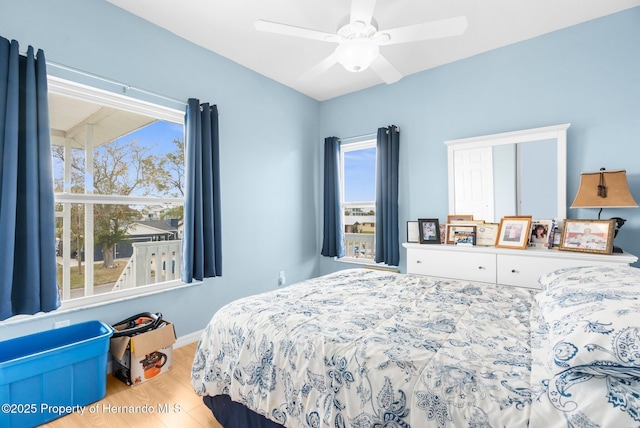 bedroom with hardwood / wood-style flooring and ceiling fan