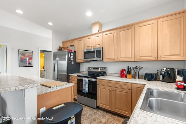 kitchen featuring appliances with stainless steel finishes and sink