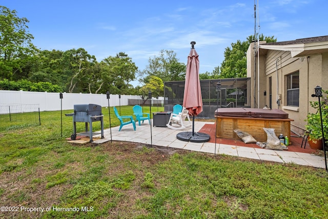 view of patio with a hot tub and a grill