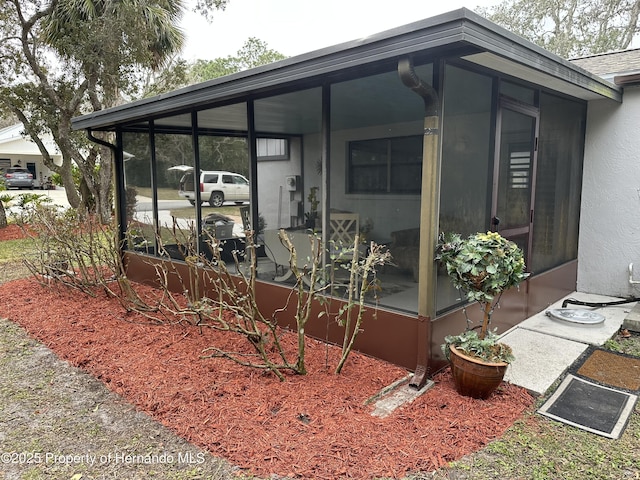 exterior space with a sunroom