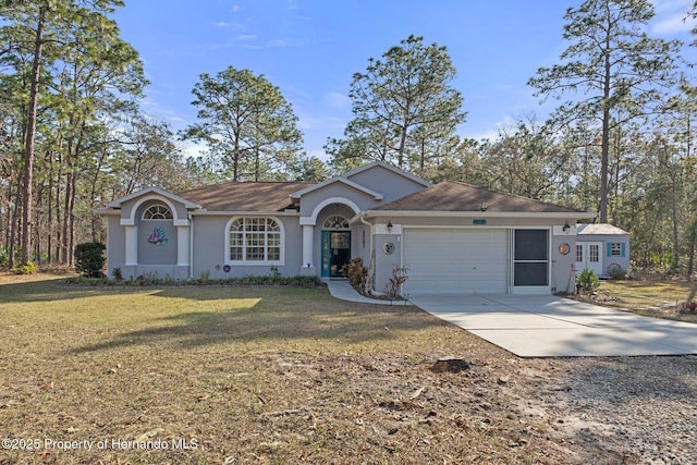 ranch-style house with a garage and a front lawn