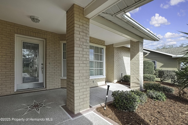 doorway to property with a patio