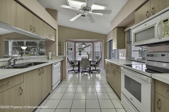 kitchen featuring sink, vaulted ceiling, light tile patterned floors, light brown cabinets, and white appliances