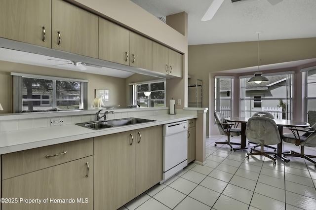 kitchen with pendant lighting, dishwasher, lofted ceiling, sink, and ceiling fan