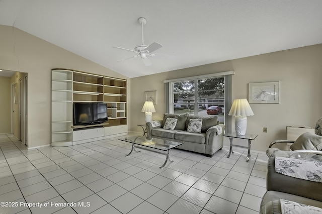 living room featuring ceiling fan, lofted ceiling, and light tile patterned floors