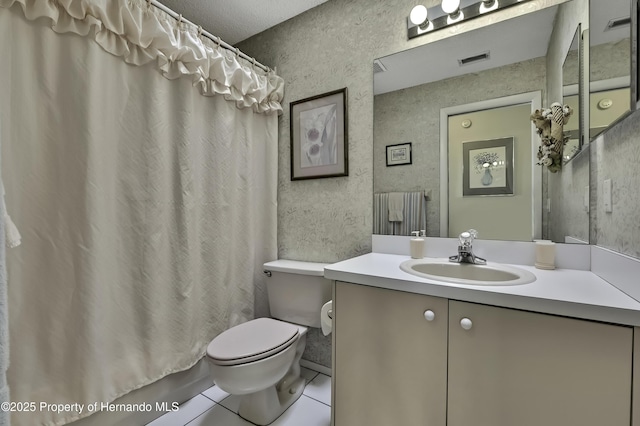 full bathroom featuring vanity, shower / tub combo, tile patterned flooring, and toilet