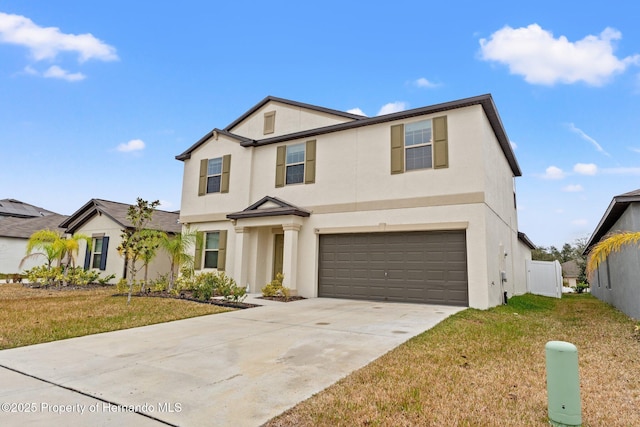 front of property with a garage and a front lawn