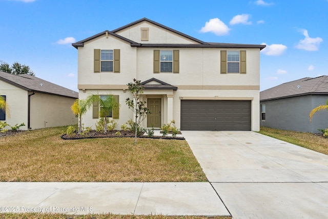 view of front of home featuring a garage and a front lawn