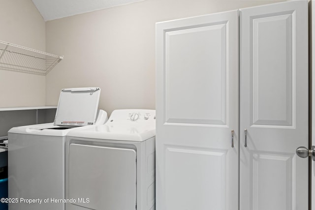 laundry room featuring washing machine and dryer