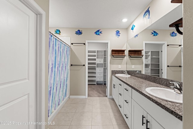 bathroom featuring vanity, tile patterned floors, and a shower with shower curtain